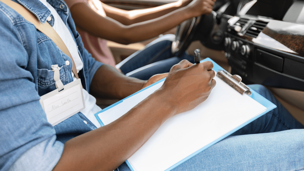 About An instructor holding a clipboard and pen